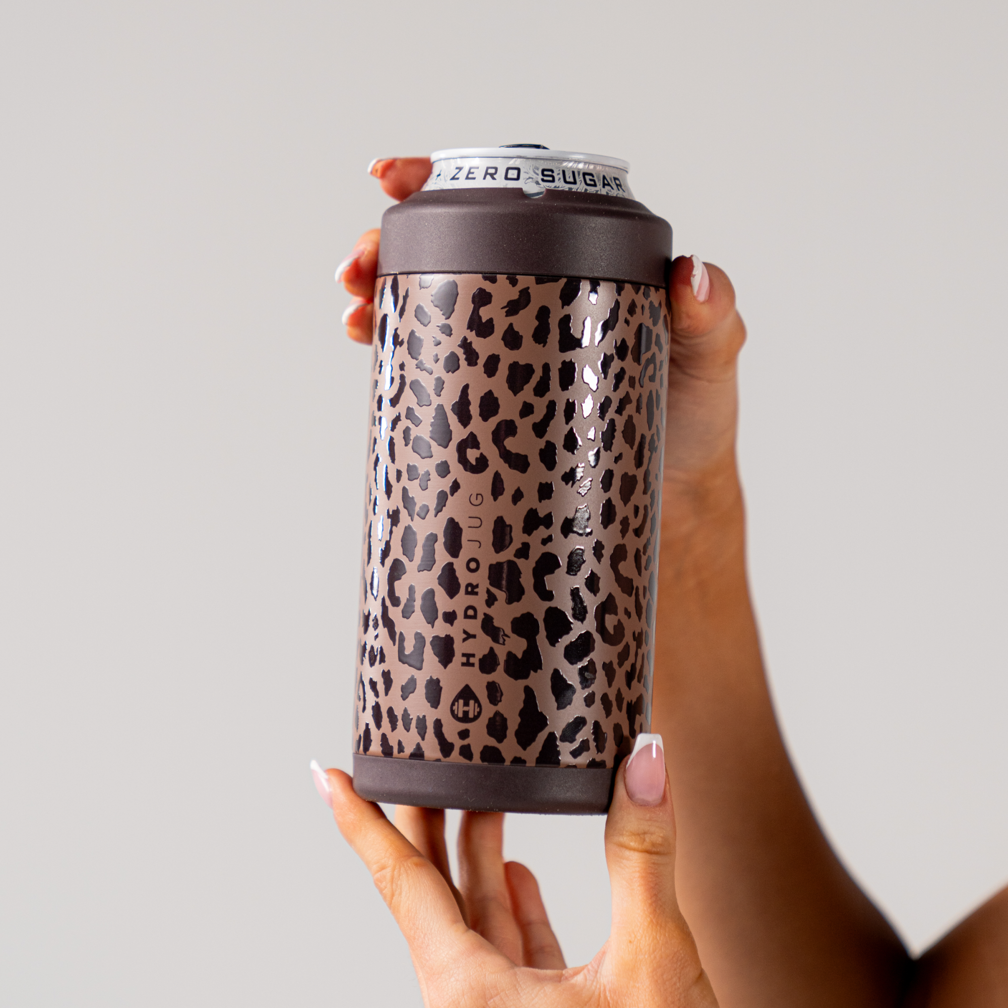 Hands Holding a HydroJug Brown Leopard Can Cooler 16oz
