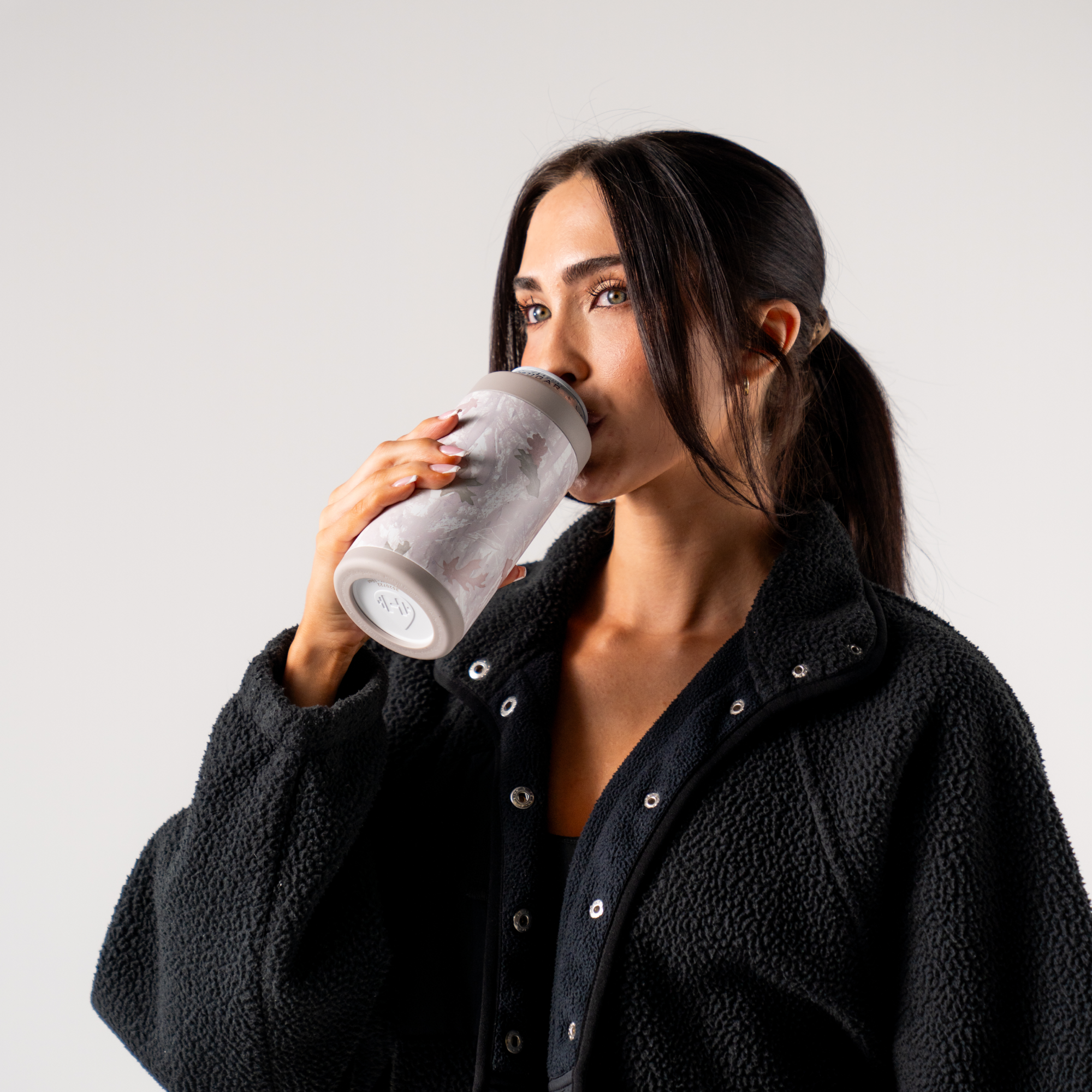 Woman Drinking from Camo Can Cooler 16oz
