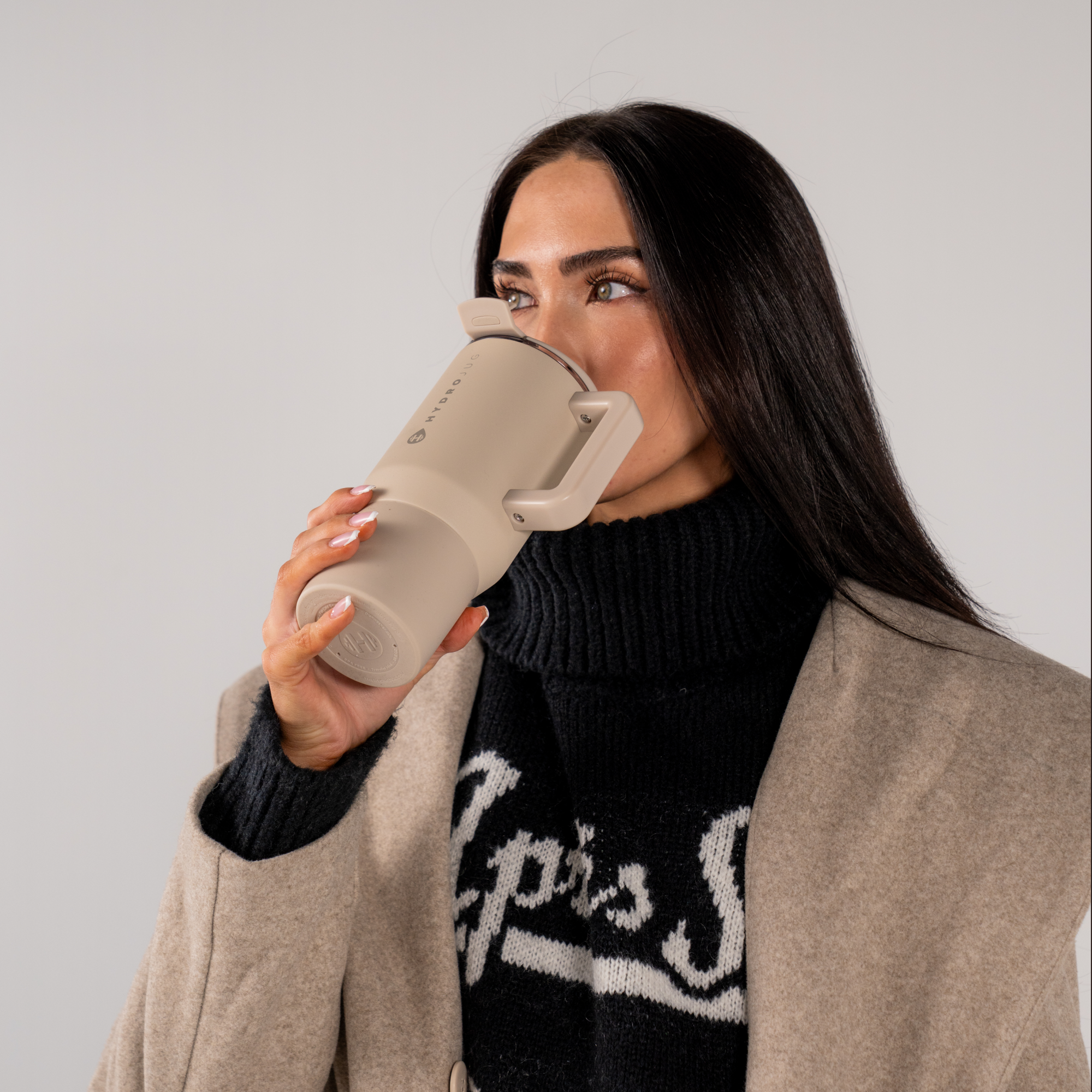 Woman Drinking from Dune Coffee Traveler