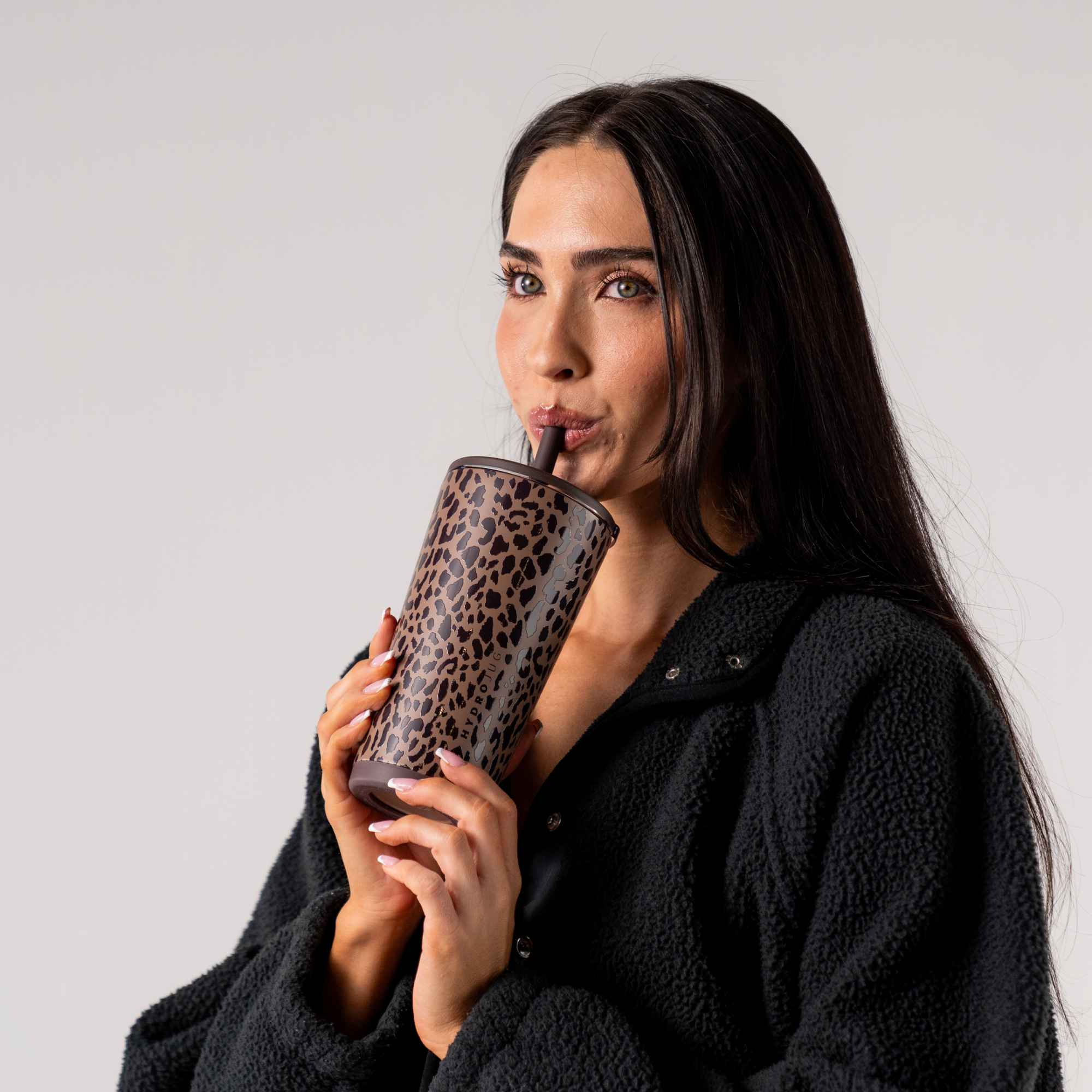 Woman Drinking from Brown LeopardbEveryday Tumbler 20oz