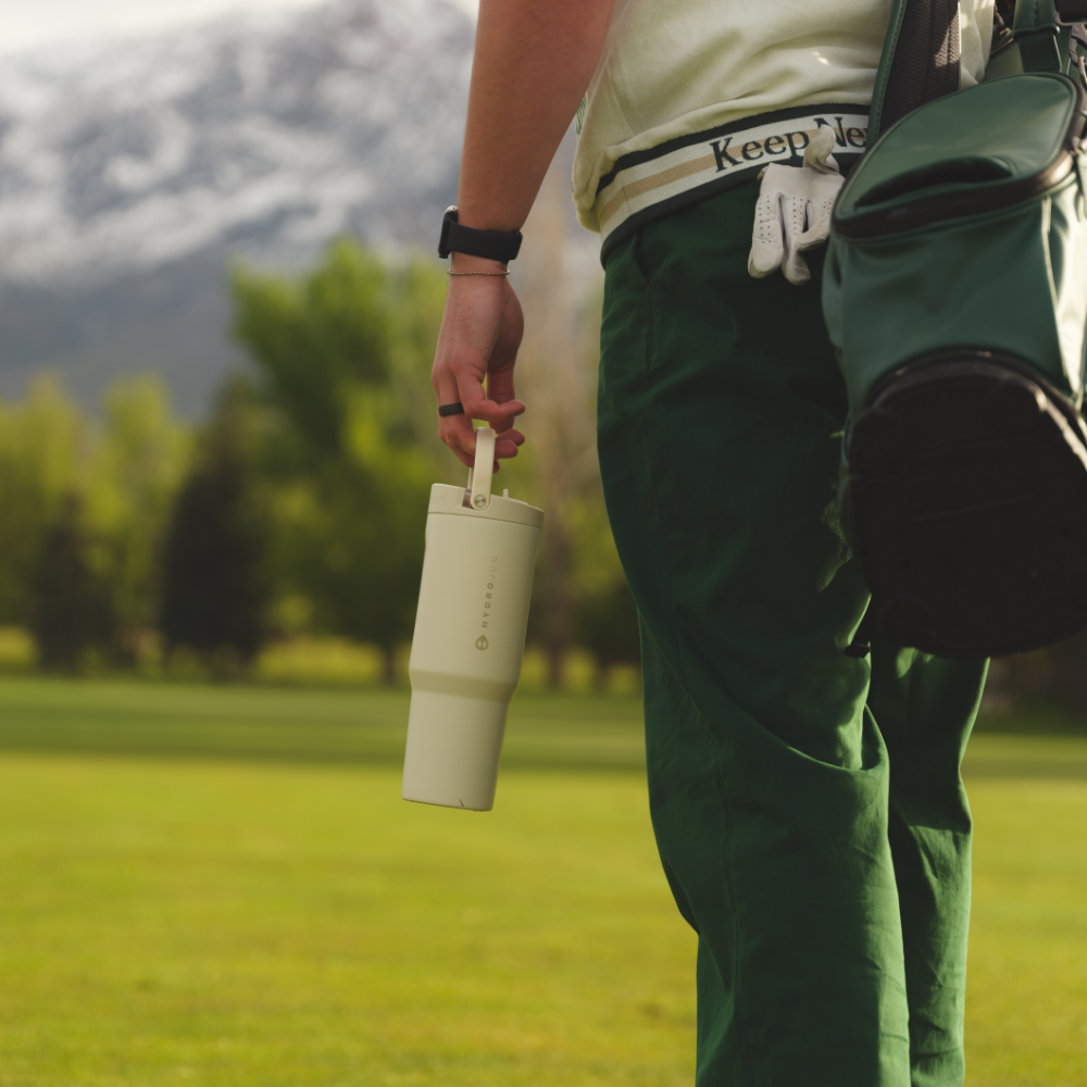 Person Holding HydroJug  Cream Sport Bottle 40oz